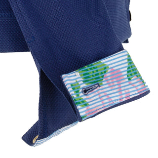 The Lisa Astra fabric stretch collared long sleeve jacket with vibrant floral print, front button closure, and front pocket details