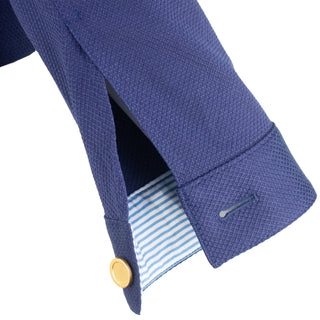 The Lisa Astra fabric stretch collared long sleeve jacket with vibrant floral print, front button closure, and front pocket details