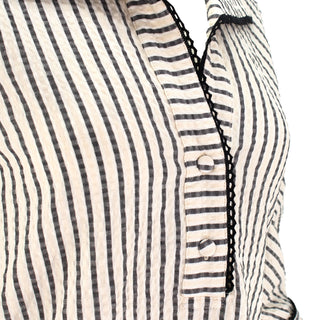 The Ravenna vertical striped collared pop-over tunic top with 3/4 sleeves, button cuffs, and relaxed polished silhouette