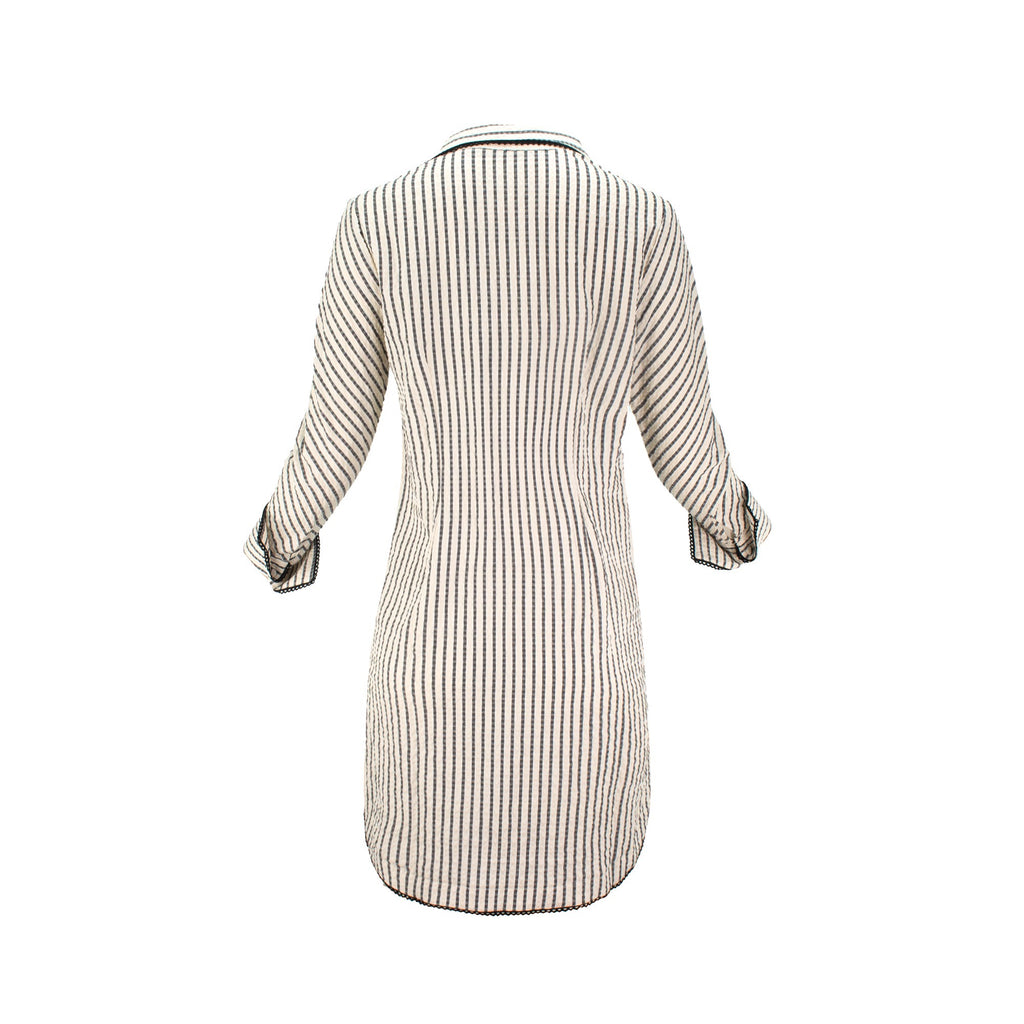 The Urbino striped long sleeve collared pop-over shirt dress with vertical stripes, relaxed lapel neckline, contrast black trim detail, and lightweight breathable fabric