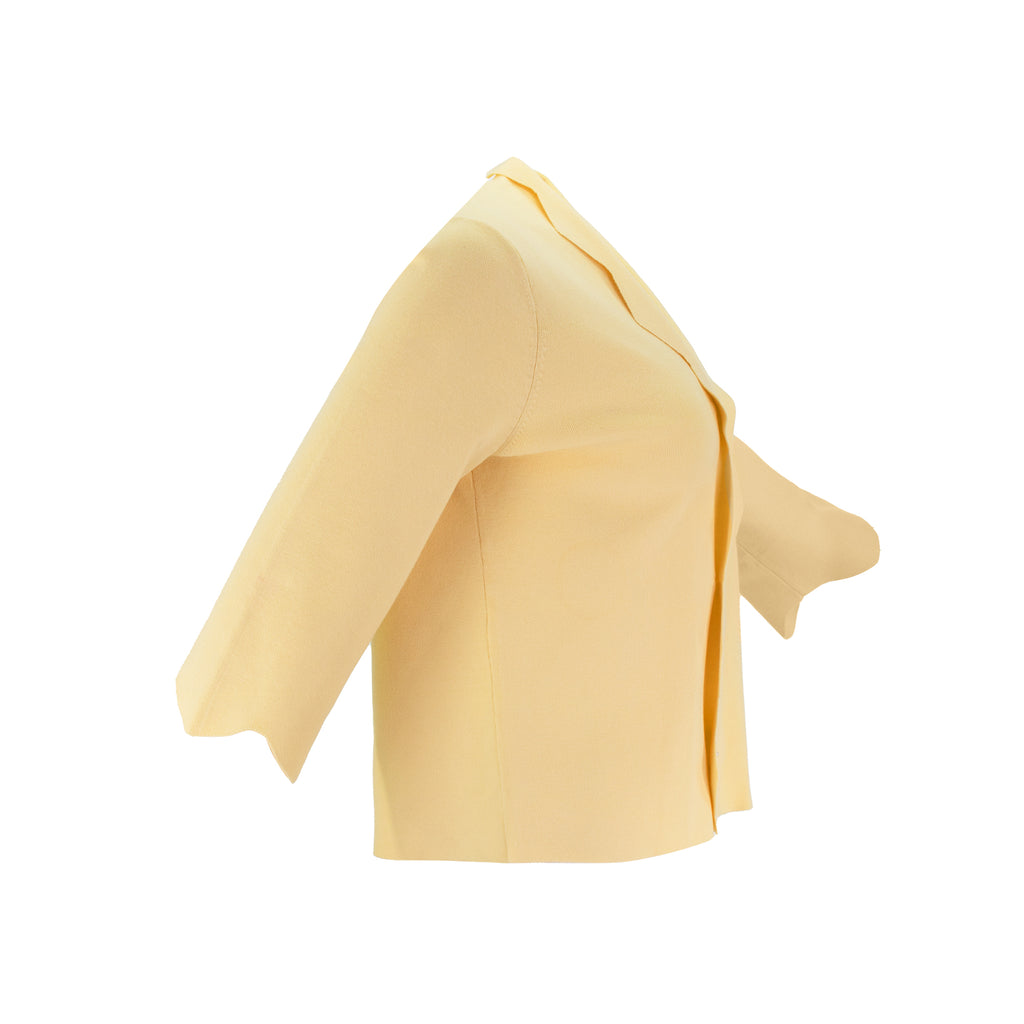 The Thalassa Stolen Softness bolero cardigan jacket with 3/4 sleeves, scalloped edge trim along center front and cuffs, fluid draped silhouette, and softly sculpted knit shape
