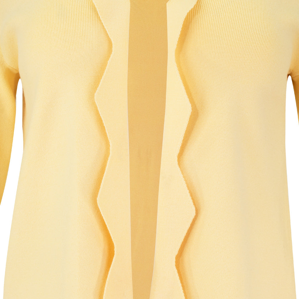 The Thalassa Stolen Softness bolero cardigan jacket with 3/4 sleeves, scalloped edge trim along center front and cuffs, fluid draped silhouette, and softly sculpted knit shape