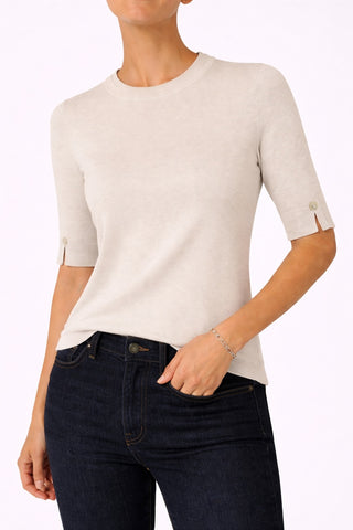 The Gee-Gee Stolen Softness crew neck elbow sleeve knit tee sweater top with clean silhouette, side slit, and shell-colored button detail