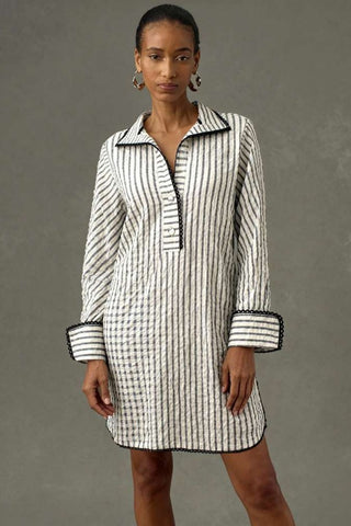 The Urbino striped long sleeve collared pop-over shirt dress with vertical stripes, relaxed lapel neckline, contrast black trim detail, and lightweight breathable fabric