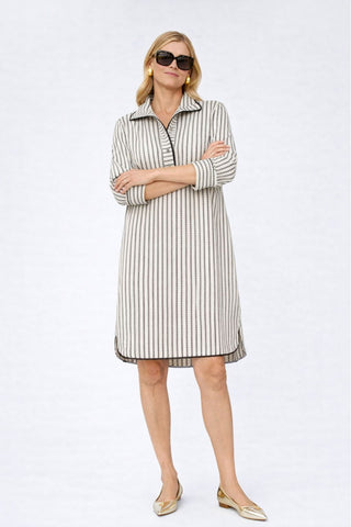 The Urbino striped long sleeve collared pop-over shirt dress with vertical stripes, relaxed lapel neckline, contrast black trim detail, and lightweight breathable fabric