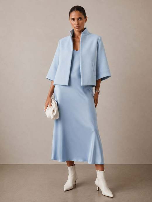 The Bristol Jacket in Sky over a slip dress