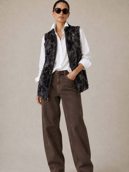 The Bern Vest in Chinchilla over a white shirt and brown denim